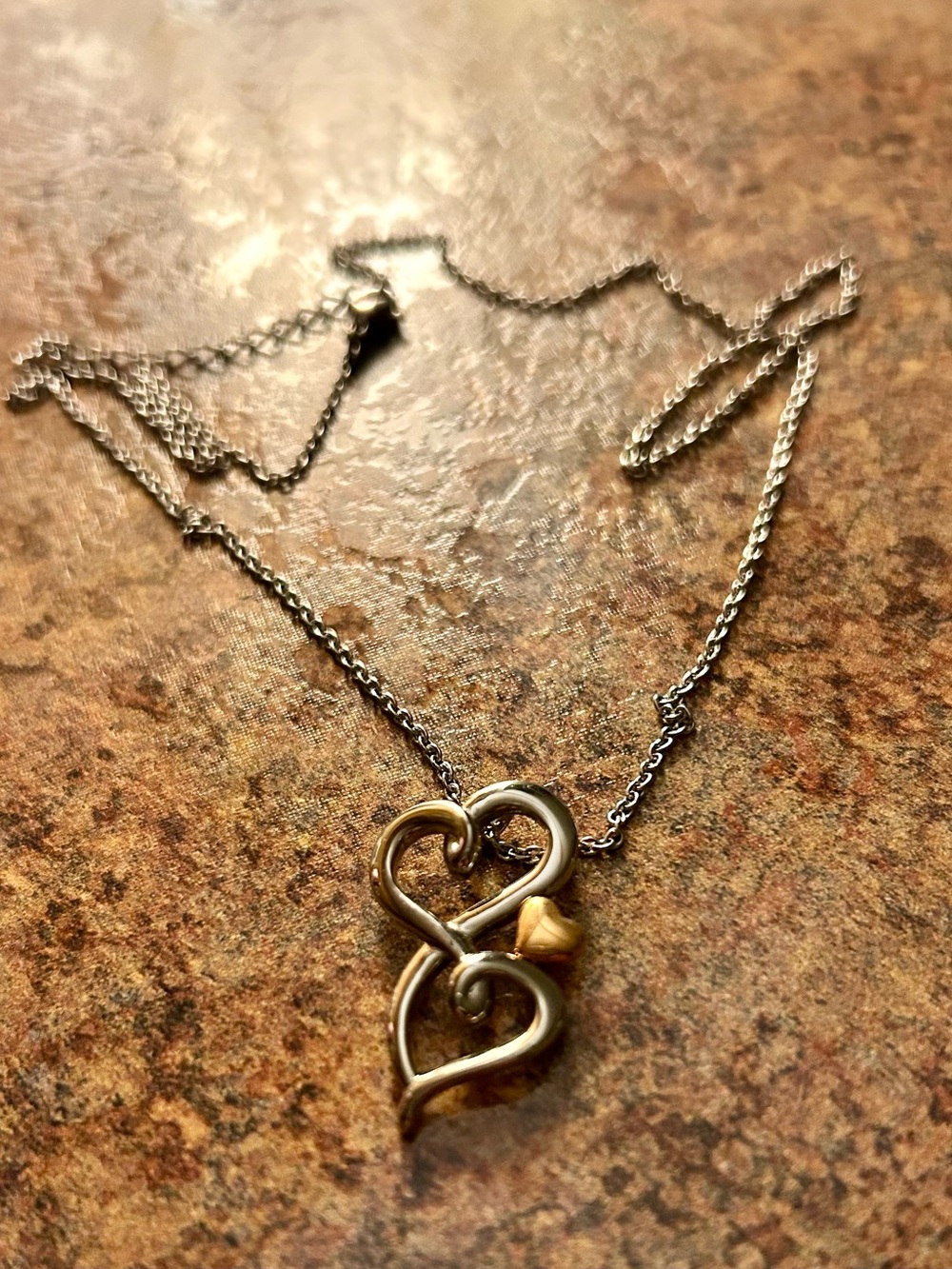 Interlocked Heart Pendant Necklace in Silver and Gold